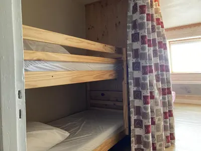 Un ou plusieurs lits dans un hébergement de l'établissement Studio montagne