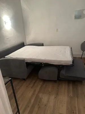 Un ou plusieurs lits dans un hébergement de l'établissement Studio 17 1 chambre
