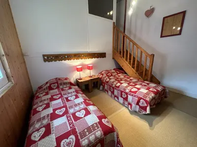 Un ou plusieurs lits dans un hébergement de l'établissement Appartement esprit montagne