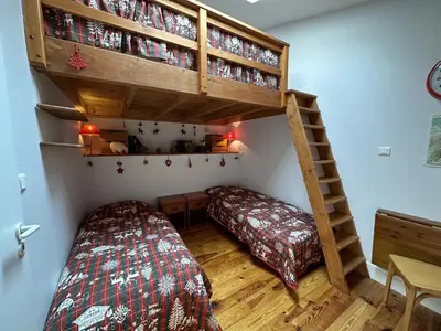 Un ou plusieurs lits dans un hébergement de l'établissement Appartement esprit montagne