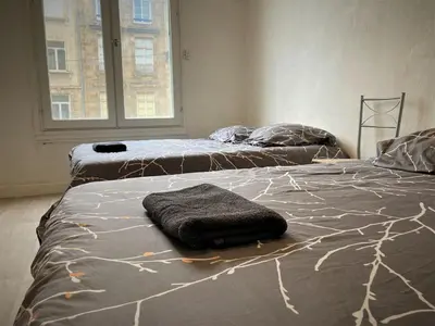 Un ou plusieurs lits dans un hébergement de l'établissement Appartement triple dans le centre de Limoges