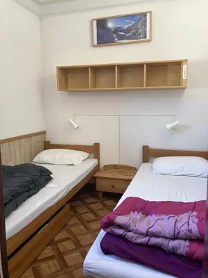 Un ou plusieurs lits dans un hébergement de l'établissement Duplex 3 chambres Griou centre station