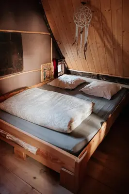 Un ou plusieurs lits dans un hébergement de l'établissement La Ferme des Histoires Mélangées