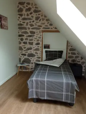 Un ou plusieurs lits dans un hébergement de l'établissement Entre Dômes et Sancy - Le moderne