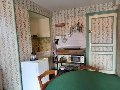 Cuisine ou kitchenette dans l'établissement grand studio douillet et lumineux vue sur la vallée