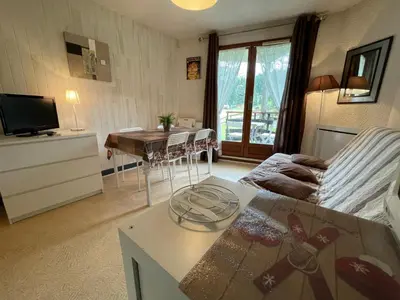 Télévision ou salle de divertissement dans l'établissement Appartement GRIOU 30
