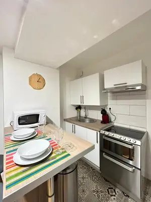 Cuisine ou kitchenette dans l'établissement Le Petit Carmes, intimiste et central
