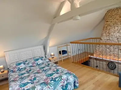 Un ou plusieurs lits dans un hébergement de l'établissement Maison cosy pour couple avec spa privé en Périgord - FR-1-616-507