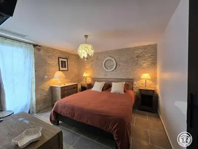 Un ou plusieurs lits dans un hébergement de l'établissement Maison en pierres au cœur du Périgord, 10 personnes, charme authentique - FR-1-616-508