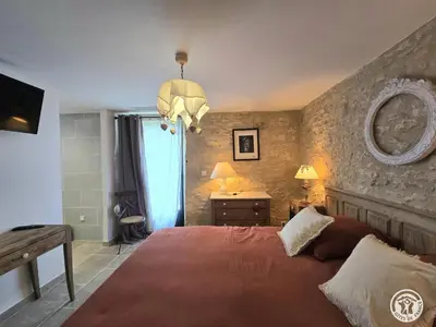 Un ou plusieurs lits dans un hébergement de l'établissement Maison en pierres au cœur du Périgord, 10 personnes, charme authentique - FR-1-616-508
