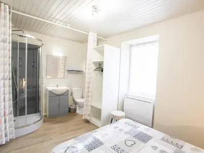 Un ou plusieurs lits dans un hébergement de l'établissement Maison périgourdine avec piscine chauffée et WiFi - FR-1-616-518