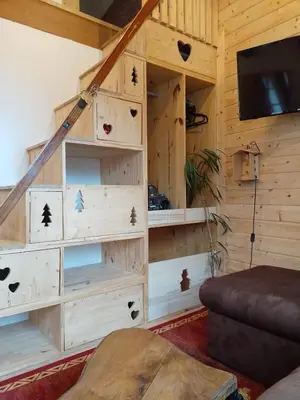 Télévision ou salle de divertissement dans l'établissement Nid cozy au Lioran