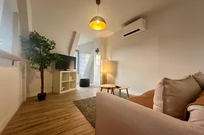 Télévision ou salle de divertissement dans l'établissement Casa Brune - Votre cocon en plein cœur de Brive