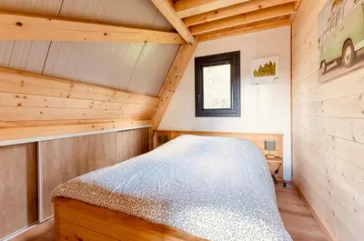 Un ou plusieurs lits dans un hébergement de l'établissement Le Tipi des Arnats
