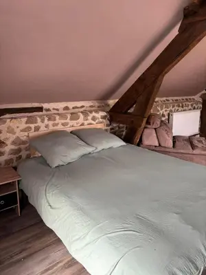 Un ou plusieurs lits dans un hébergement de l'établissement Maison typique Auvergne