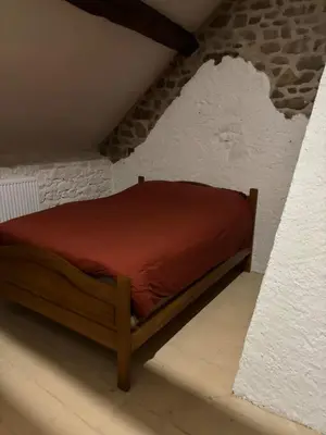 Un ou plusieurs lits dans un hébergement de l'établissement Maison typique Auvergne