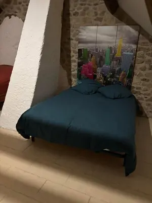 Un ou plusieurs lits dans un hébergement de l'établissement Maison typique Auvergne