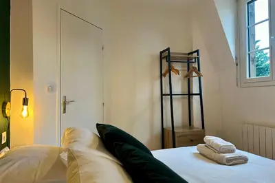 Un ou plusieurs lits dans un hébergement de l'établissement Casa Mialet - Petit Écrin de Douceur au cœur de Brive