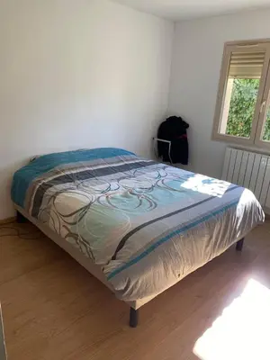 Un ou plusieurs lits dans un hébergement de l'établissement Chambre de maison de campagne
