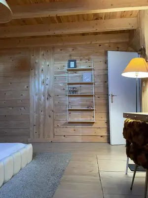 Un ou plusieurs lits dans un hébergement de l'établissement Ancienne grange typique nichée au cœur du Cantal