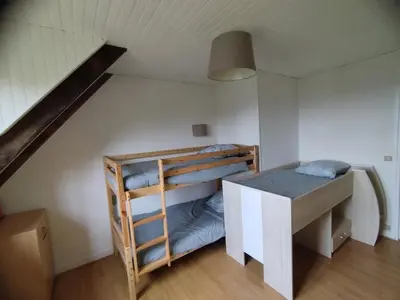 Un ou plusieurs lits dans un hébergement de l'établissement Maison typique avec 3 chambres pour 6 à 8 personnes