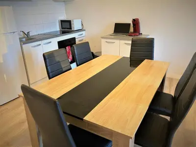 Cuisine ou kitchenette dans l'établissement Appartement triple dans le centre