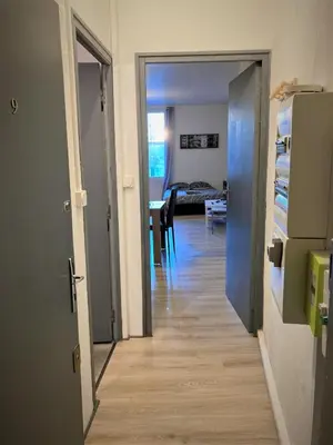 Un ou plusieurs lits dans un hébergement de l'établissement Appartement triple dans le centre