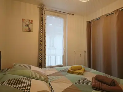 Un ou plusieurs lits dans un hébergement de l'établissement Charmant appartement pour 2 au cœur du Massif du Sancy - FR-1-858-37
