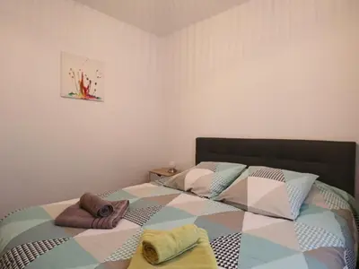 Un ou plusieurs lits dans un hébergement de l'établissement Charmant appartement pour 2 au cœur du Massif du Sancy - FR-1-858-37