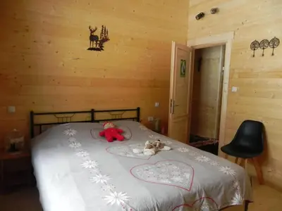Un ou plusieurs lits dans un hébergement de l'établissement Chalet avec Vue à Murat-le-Quaire - 120 m²