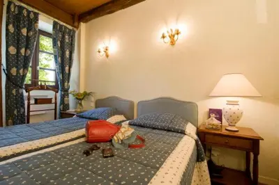 Un ou plusieurs lits dans un hébergement de l'établissement Resort Golf Château de Salles