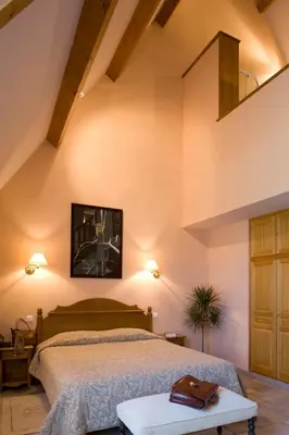 Un ou plusieurs lits dans un hébergement de l'établissement Resort Golf Château de Salles