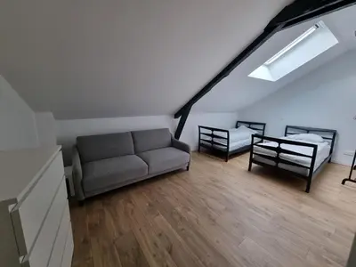 Coin salon dans l'établissement Gite 10 12 personnes Chez Max