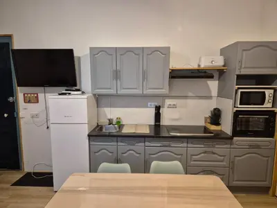 Cuisine ou kitchenette dans l'établissement Appartement 4-6 personnes plein centre