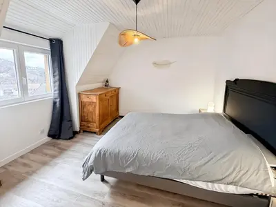 Un ou plusieurs lits dans un hébergement de l'établissement Gîte Rénové - Vue Imprenable Montagne - 2 Chambres