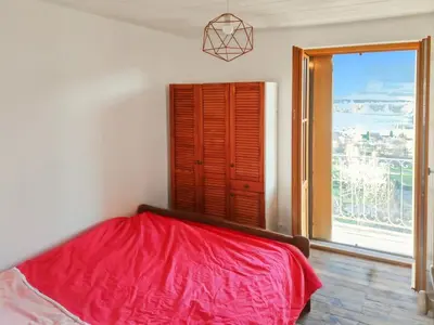 Un ou plusieurs lits dans un hébergement de l'établissement Charmante maison montagnarde - Vue panoramique
