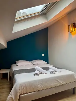 Un ou plusieurs lits dans un hébergement de l'établissement Appartement 5 cocooning Av Georges Dumas -DABNB