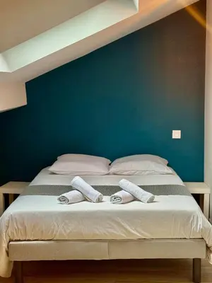 Un ou plusieurs lits dans un hébergement de l'établissement Appartement 5 cocooning Av Georges Dumas -DABNB