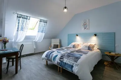 Un ou plusieurs lits dans un hébergement de l'établissement L'Instant Nouveau chambres d'hôtes