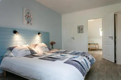 Un ou plusieurs lits dans un hébergement de l'établissement L'Instant Nouveau chambres d'hôtes