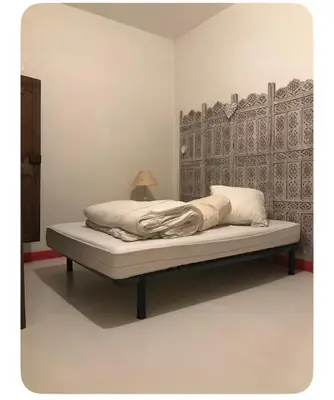 Un ou plusieurs lits dans un hébergement de l'établissement Appartement de ville