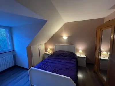 Un ou plusieurs lits dans un hébergement de l'établissement Logement à côté de la station de ski le Lioran dans le Cantal