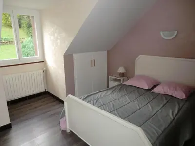 Un ou plusieurs lits dans un hébergement de l'établissement Logement à côté de la station de ski le Lioran dans le Cantal