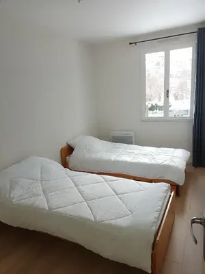 Un ou plusieurs lits dans un hébergement de l'établissement Escapade montagnarde pour la famille