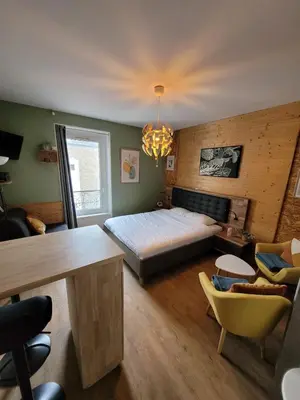 Un ou plusieurs lits dans un hébergement de l'établissement Appartement à La bourboule