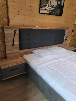 Un ou plusieurs lits dans un hébergement de l'établissement Appartement à La bourboule