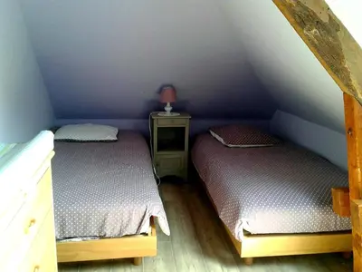 Un ou plusieurs lits dans un hébergement de l'établissement Charmante maison de campagne