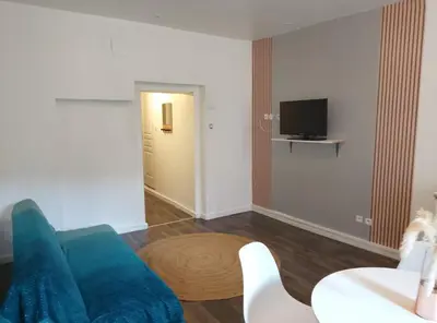 Télévision ou salle de divertissement dans l'établissement Appartement Entier 1
