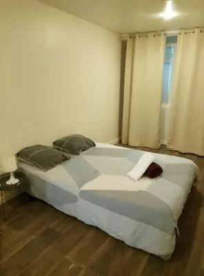 Un ou plusieurs lits dans un hébergement de l'établissement Appartement Entier 1