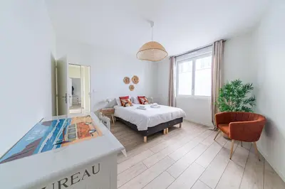 Un ou plusieurs lits dans un hébergement de l'établissement Le Berthelot Coeur de Brive - 2 Chambres